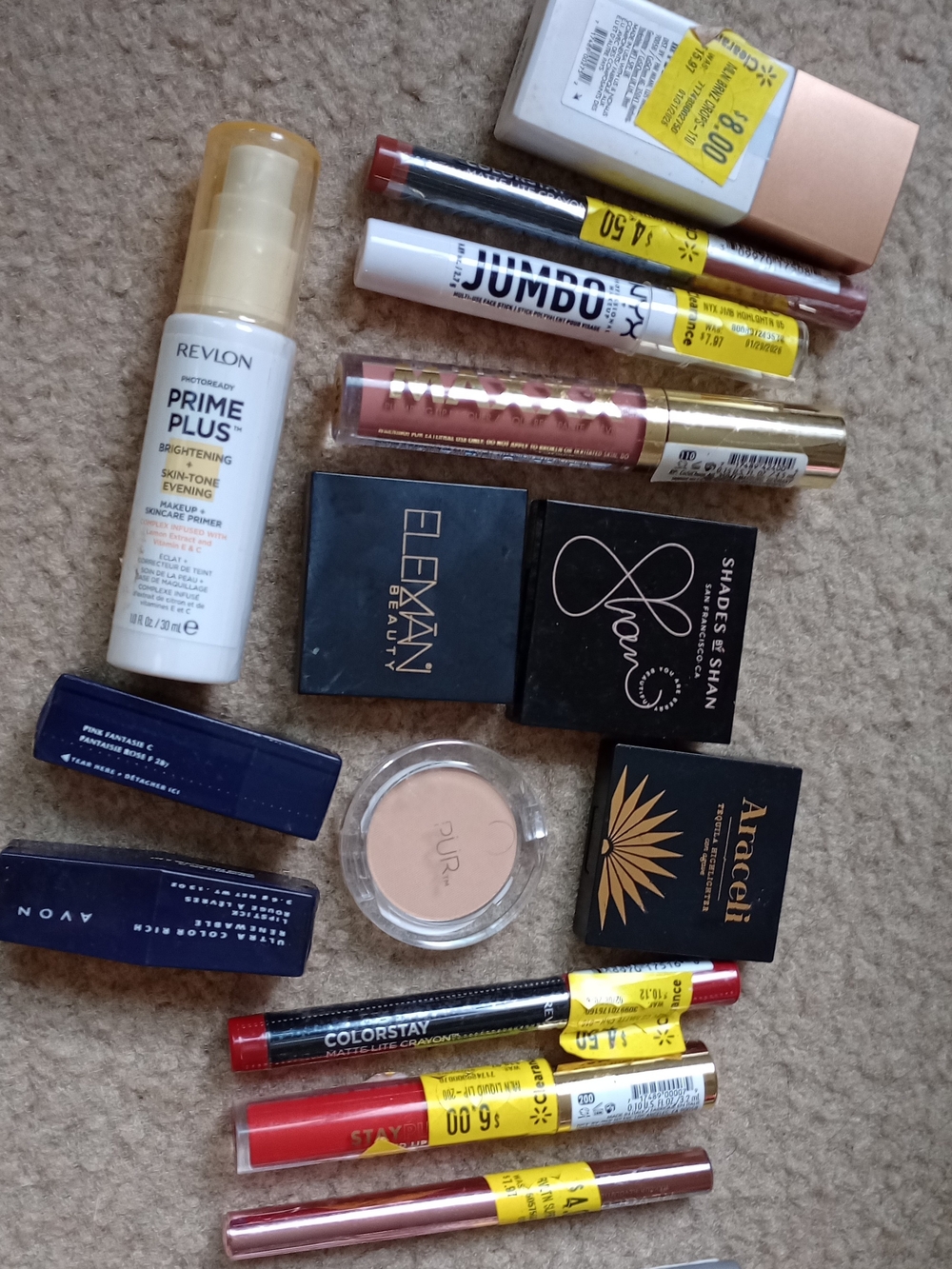 collection of makeup includes a variety of face, eye, and lip products